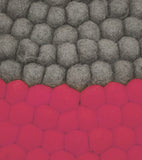 Tapis rond en boules de laine feutrée