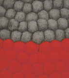Tapis rond en boules de laine feutrée