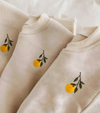 Ensemble uni avec broderie orange